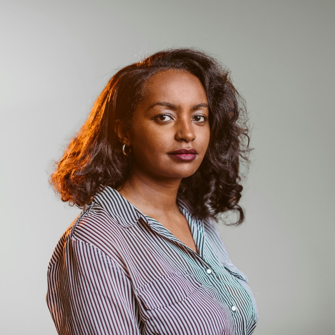 Professional Brazilian woman, studio lighting designer, smiling portrait