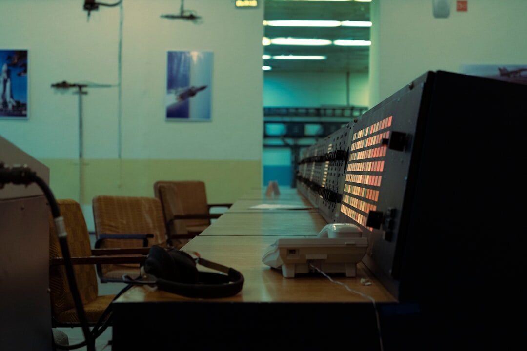 Broadcast control room with multiple monitors and mixing panels